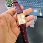 Franklord Champagne Gold rectangular watch showcasing sunburst dial and croc-textured maroon strap