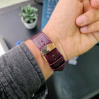 Franklord logo butterfly clasp on maroon leather strap of Champagne Gold variant