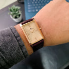 Wrist shot of Franklord Champagne Gold watch showcasing gold dial and sleek design