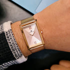 Franklord Champagne Luxe rectangular watch worn on wrist with formal outfit