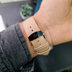 Close-up of black Franklord logo clasp on beige strap from the Dusky Royale variant