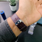 Close-up of stainless steel butterfly clasp on Franklord Ivory Crown's maroon textured strap