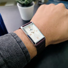  Ivory Crown watch on wrist with formal shirt, showcasing vintage charm and minimalist elegance