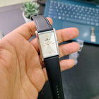 Full front view of Monarch Silver rectangular dial watch with black leather strap and silver case