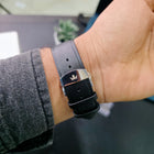 Close-up of Monarch Silver black leather strap with stainless steel butterfly clasp featuring Franklord logo
