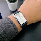Angled wrist view of Franklord Monarch Silver rectangular watch highlighting polished silver case