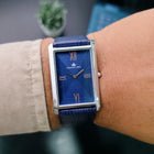 Handheld straight-on shot of Franklord Ocean Crest with royal blue dial and silver case