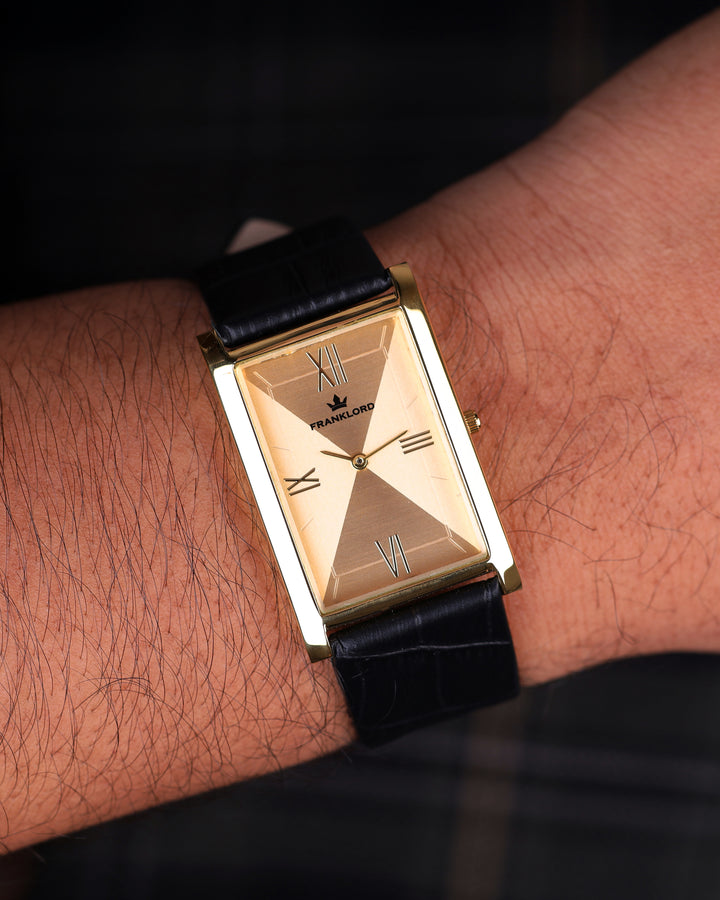 Detailed close-up of Franklord Royal Gold Heritage rectangular gold dial watch on wrist with black leather strap