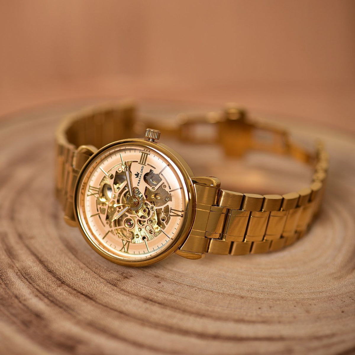 Franklord Mechanis Regal Gold Automatic Watch with open bracelet, showcasing its intricate gold skeleton dial and elegant design.