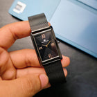 Complete Franklord Indian Tank Noir Luxe watch shown in hand with full mesh strap