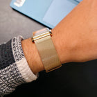 Side profile of slim rectangular Champagne Luxe watch showing sleek crown