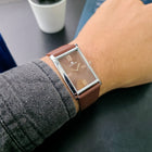 Side angle wrist shot of Franklord Rustic Bronze watch with brown sunburst dial