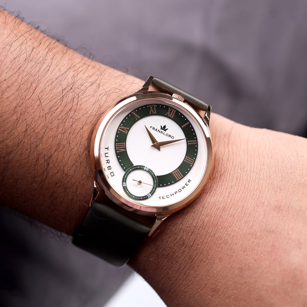 Wrist shot of the Franklord Split Turbo Emerald Core watch with deep green outer ring and rose gold Roman dial.