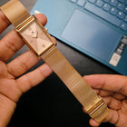 Full display of Franklord Champagne Luxe rectangular watch held in hand