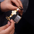Back side of Franklord Royal Gold Heritage watch showing stainless steel case and butterfly clasp