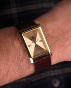 Franklord Royal Gold Heritage luxury gold rectangular watch worn on wrist with shirt